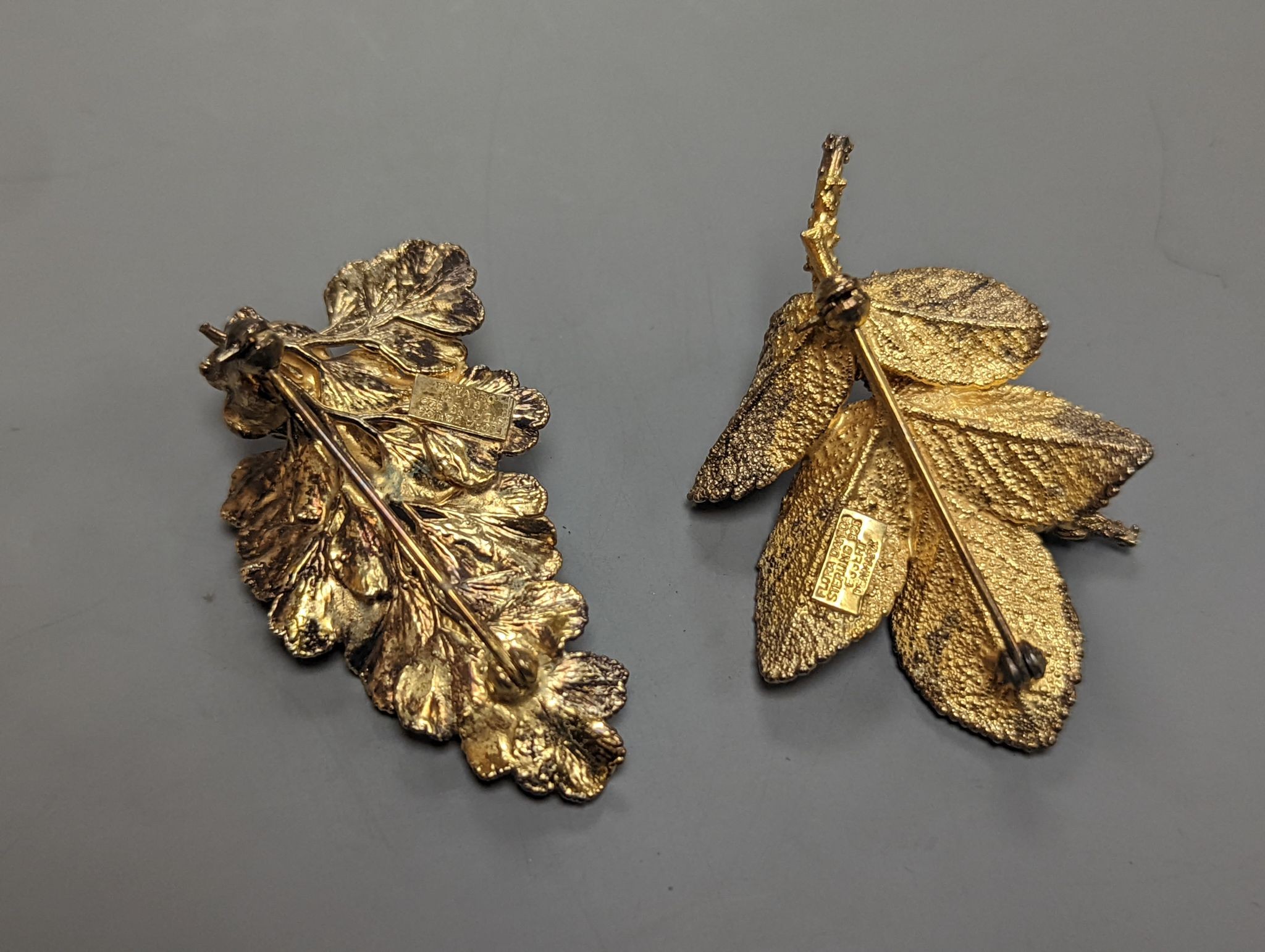 Two Flora Danica gilt white metal foliate brooches, with boxes, largest 46mm.